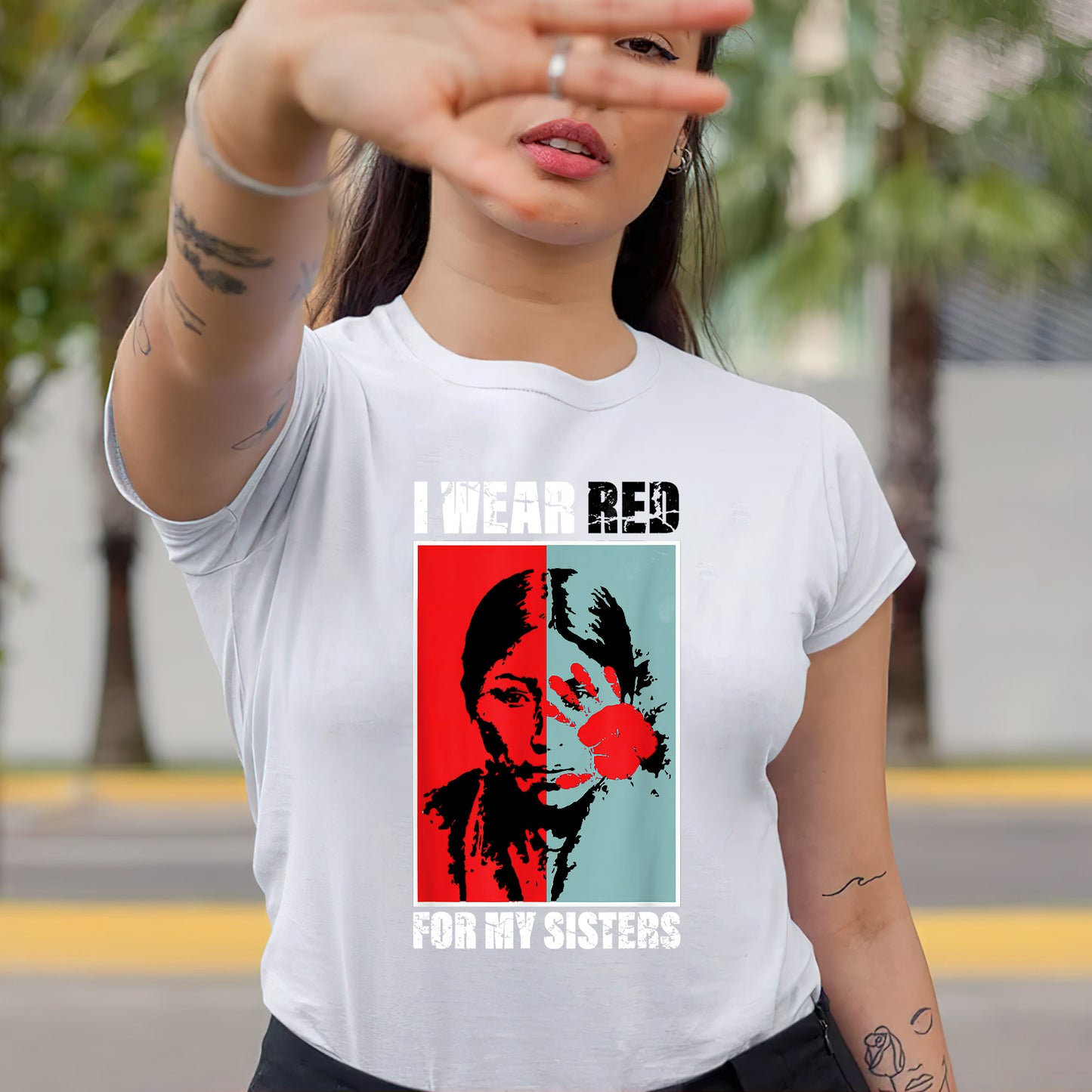 a woman wearing a t - shirt with a picture of a man on it