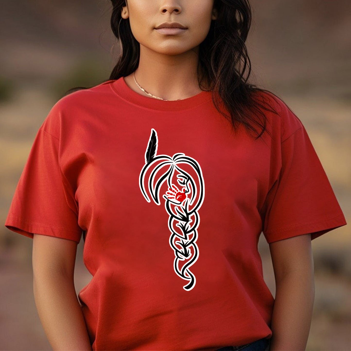 a woman wearing a red shirt with a tattoo design on it