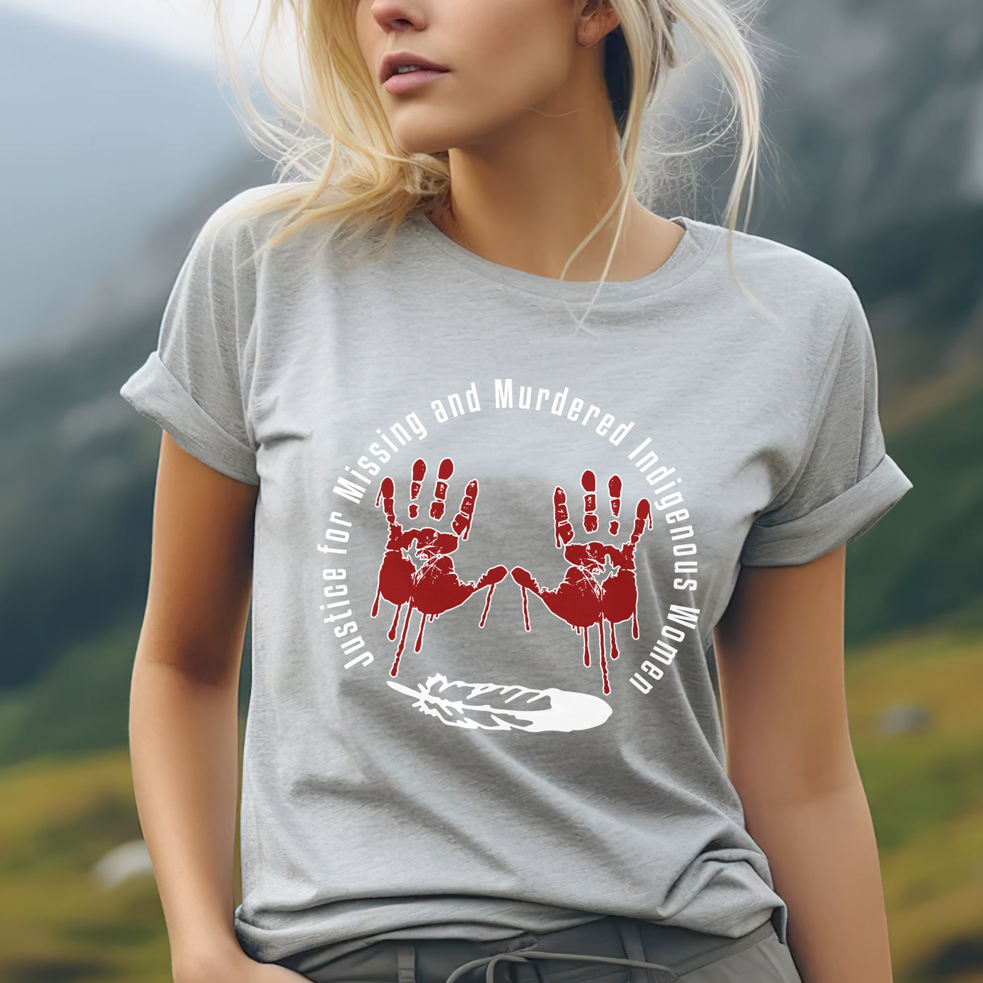 a woman wearing a grey shirt with a red hand print