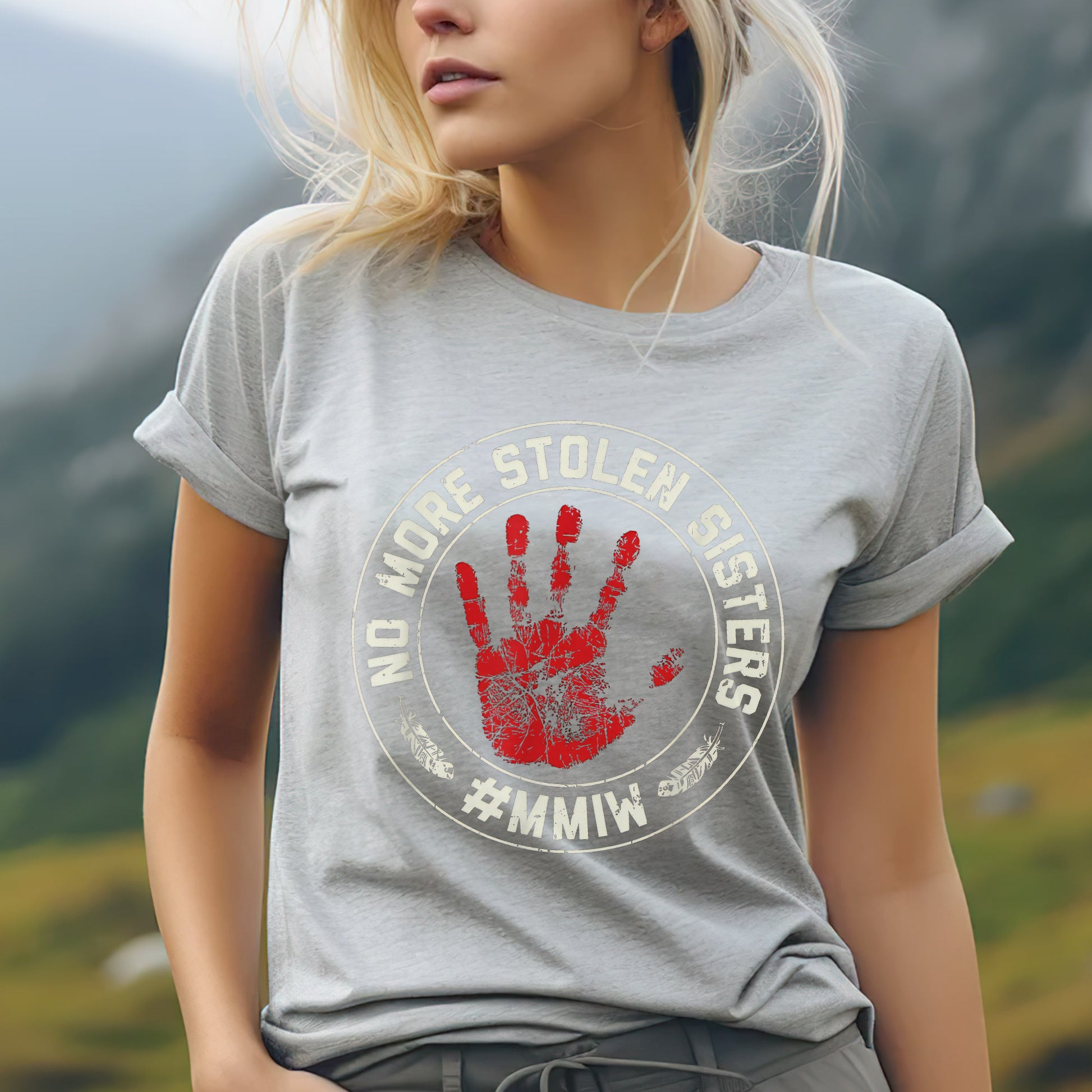 a woman wearing a grey shirt with a red hand print