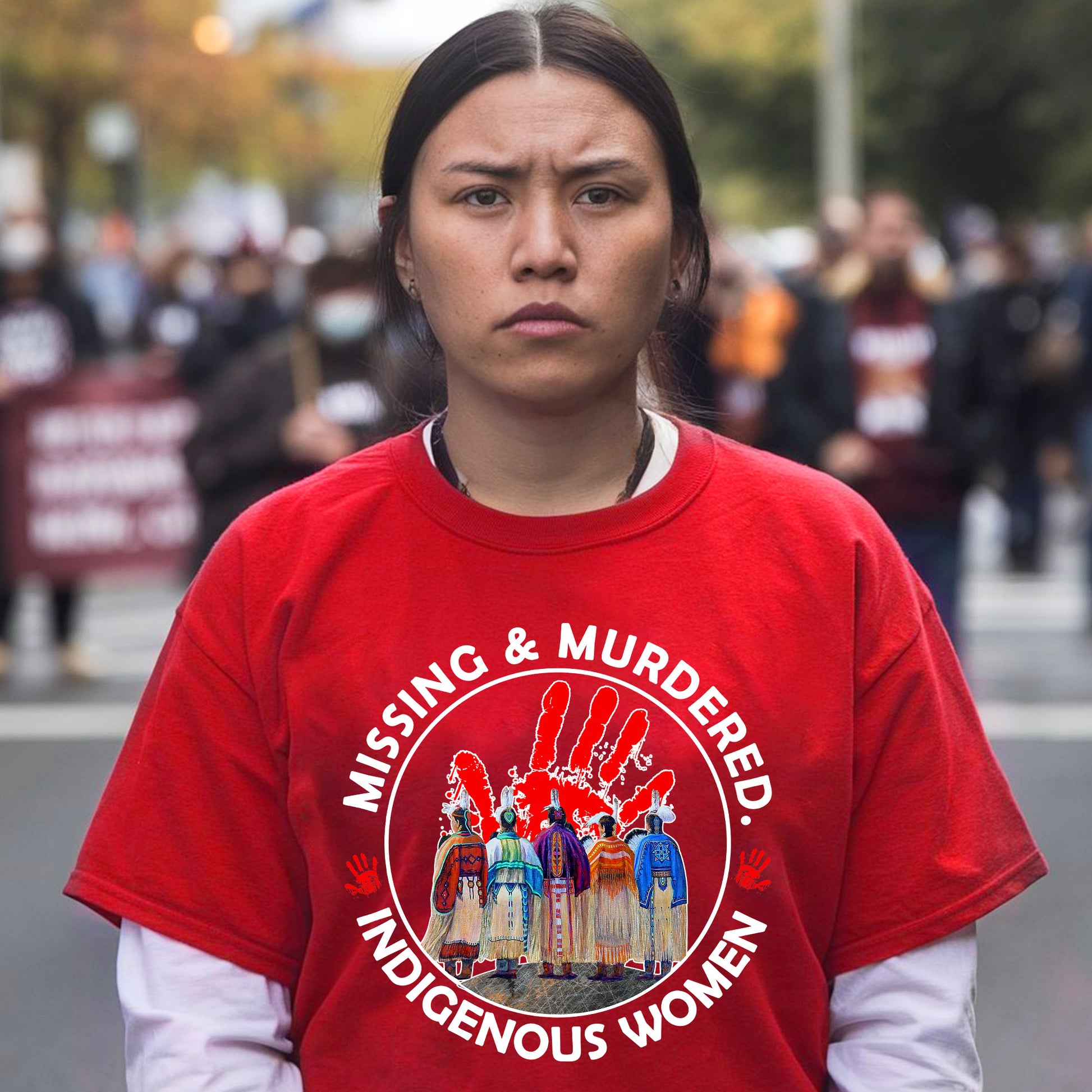 a woman in a red shirt is standing on the street