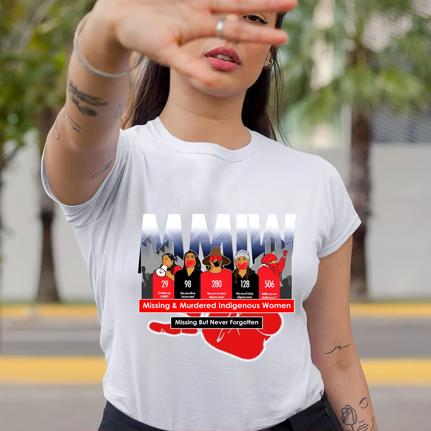 a woman wearing a t - shirt with a picture of a group of people on