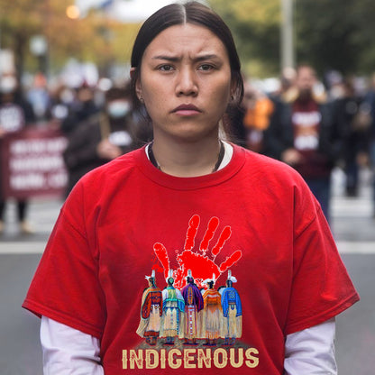 a woman in a red shirt is standing on the street