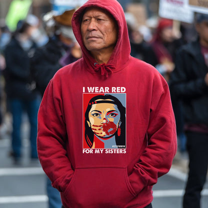 a man wearing a red hoodie with a picture of a woman on it