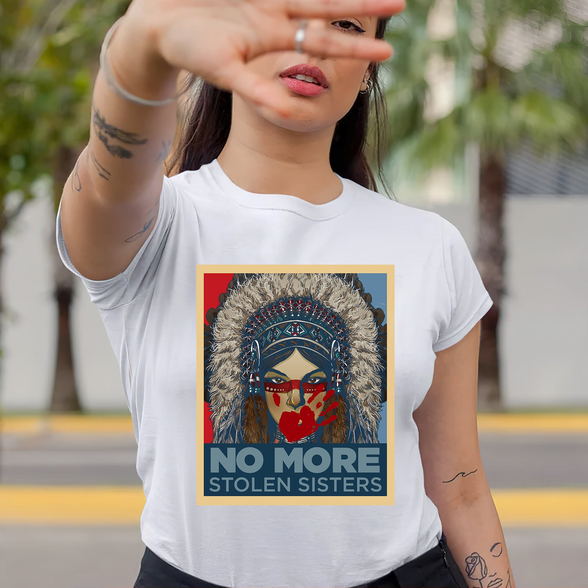 a woman wearing a t - shirt with a picture of a native american woman on