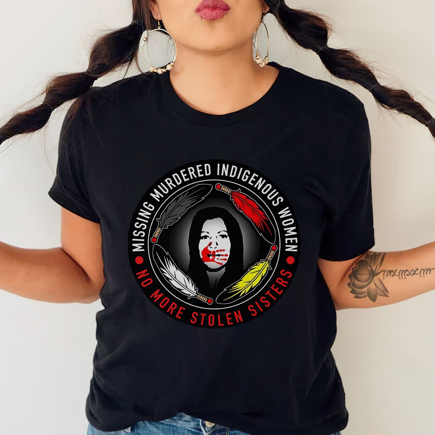 a woman wearing a black t - shirt with a clown on it