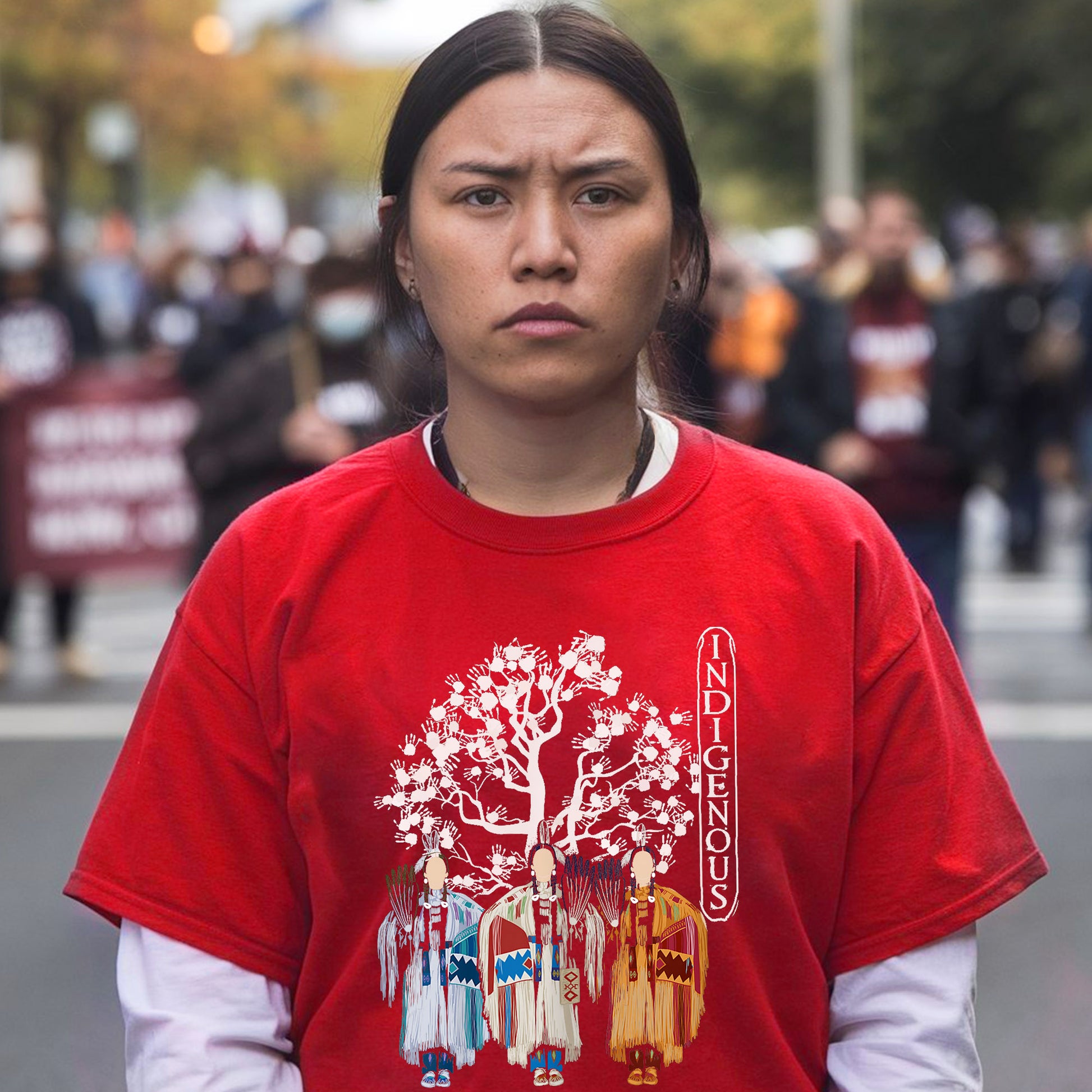 a woman in a red shirt is standing on the street