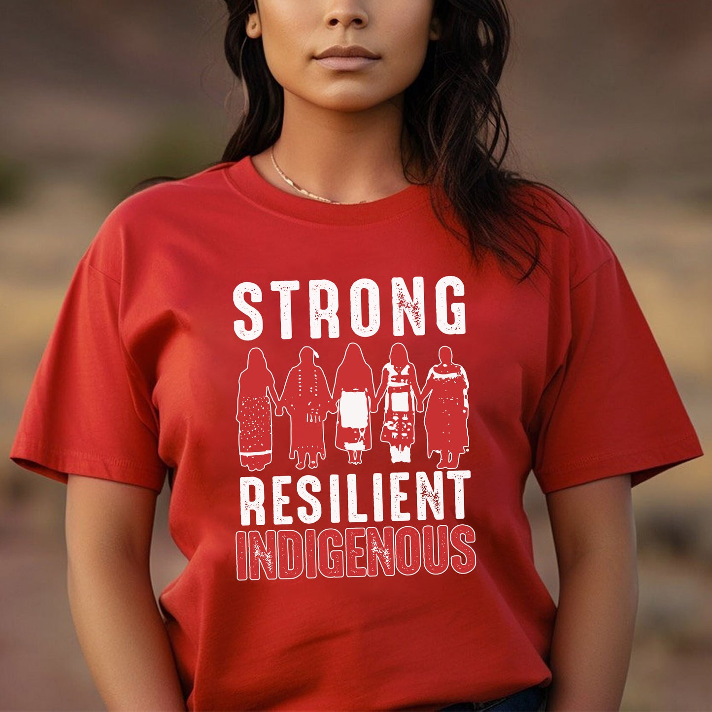 a woman wearing a red shirt that says strong resilint indigenouss