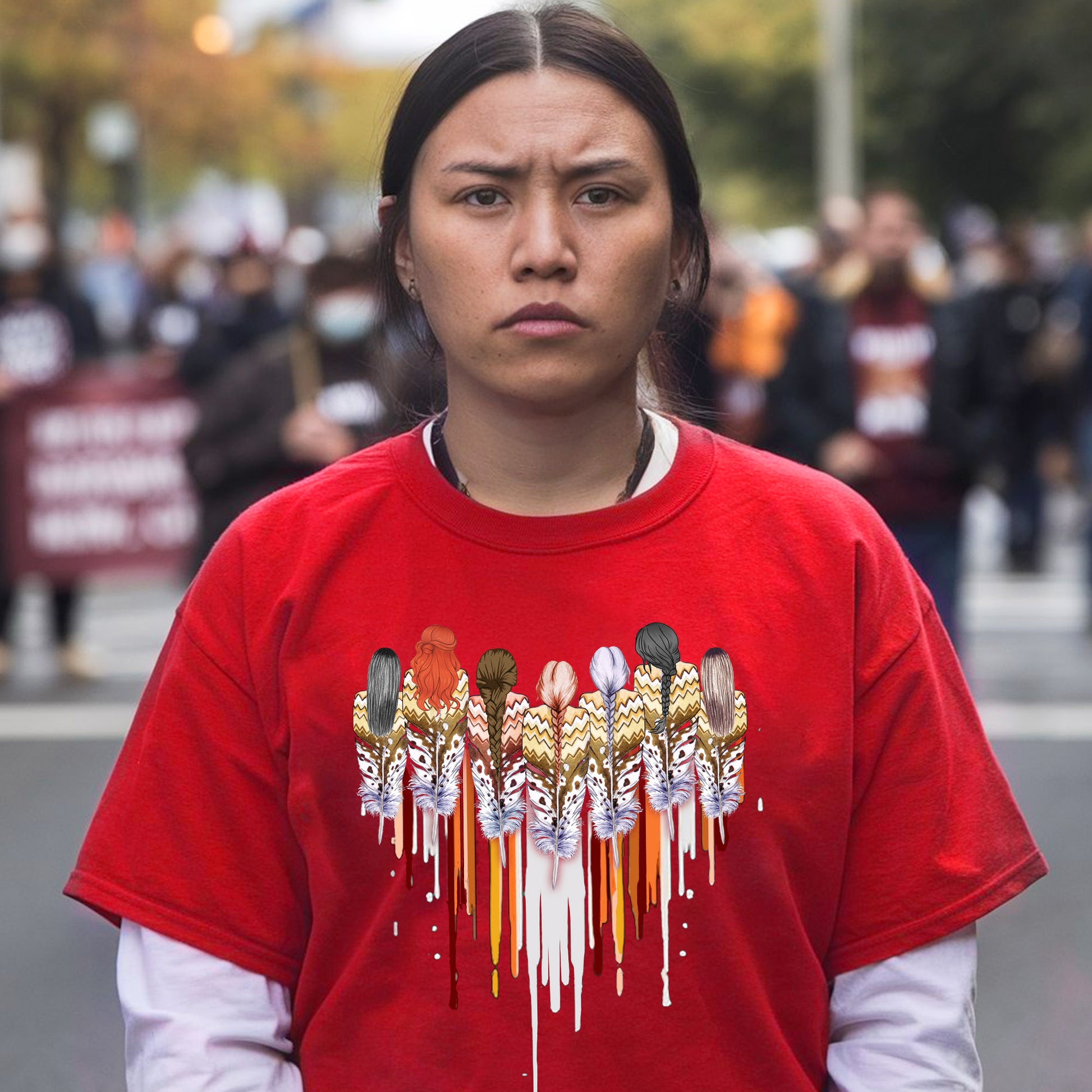 a woman in a red shirt is standing on the street