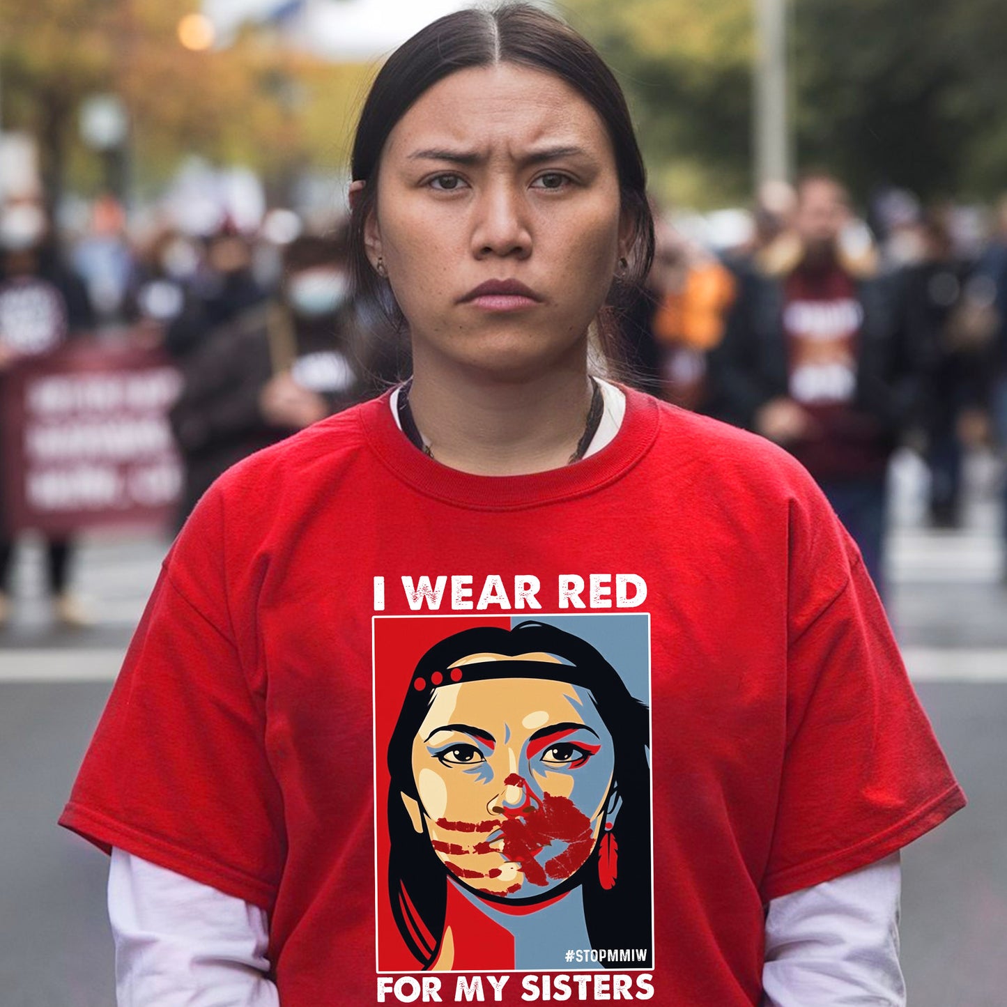 a woman wearing a red shirt with a picture of a woman's face on