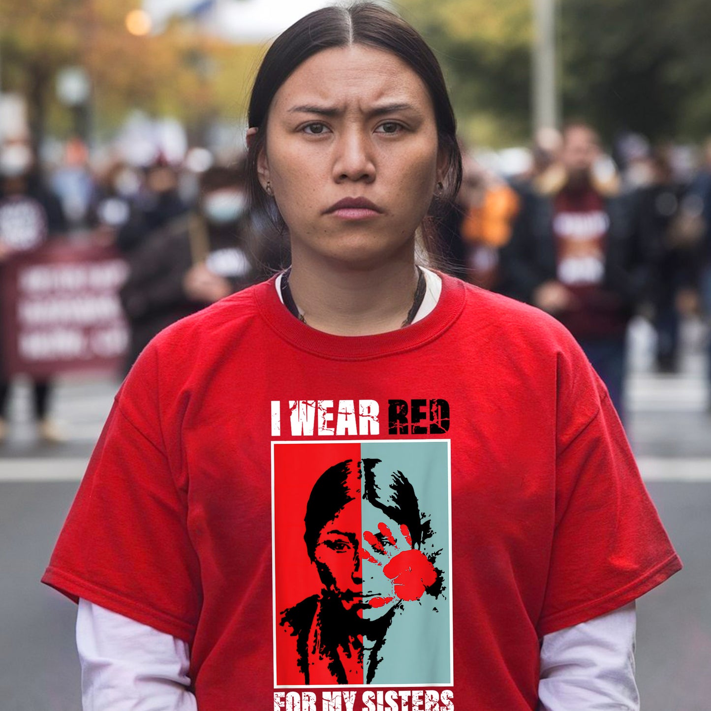 a woman wearing a red shirt with a picture of a woman on it