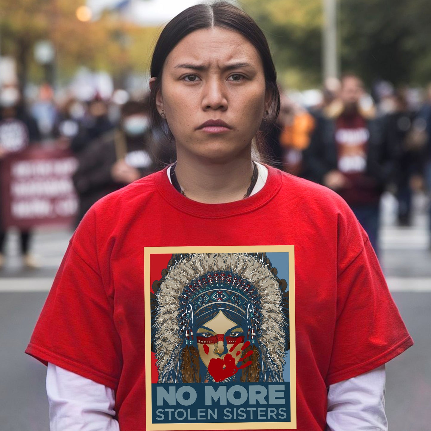 a woman wearing a t - shirt with a picture of a native american woman on