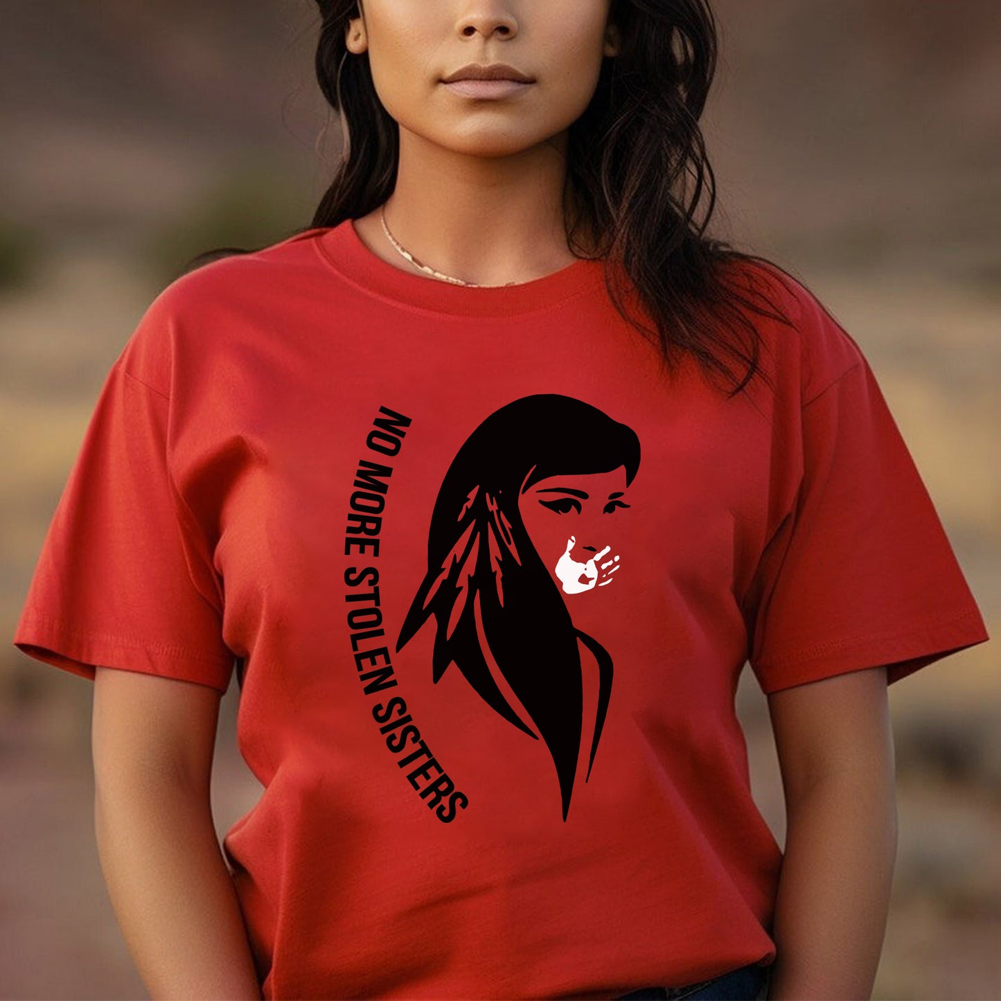 a woman wearing a red t - shirt with a native american girl on it