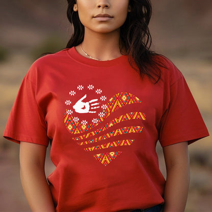 a woman wearing a red shirt with a heart on it