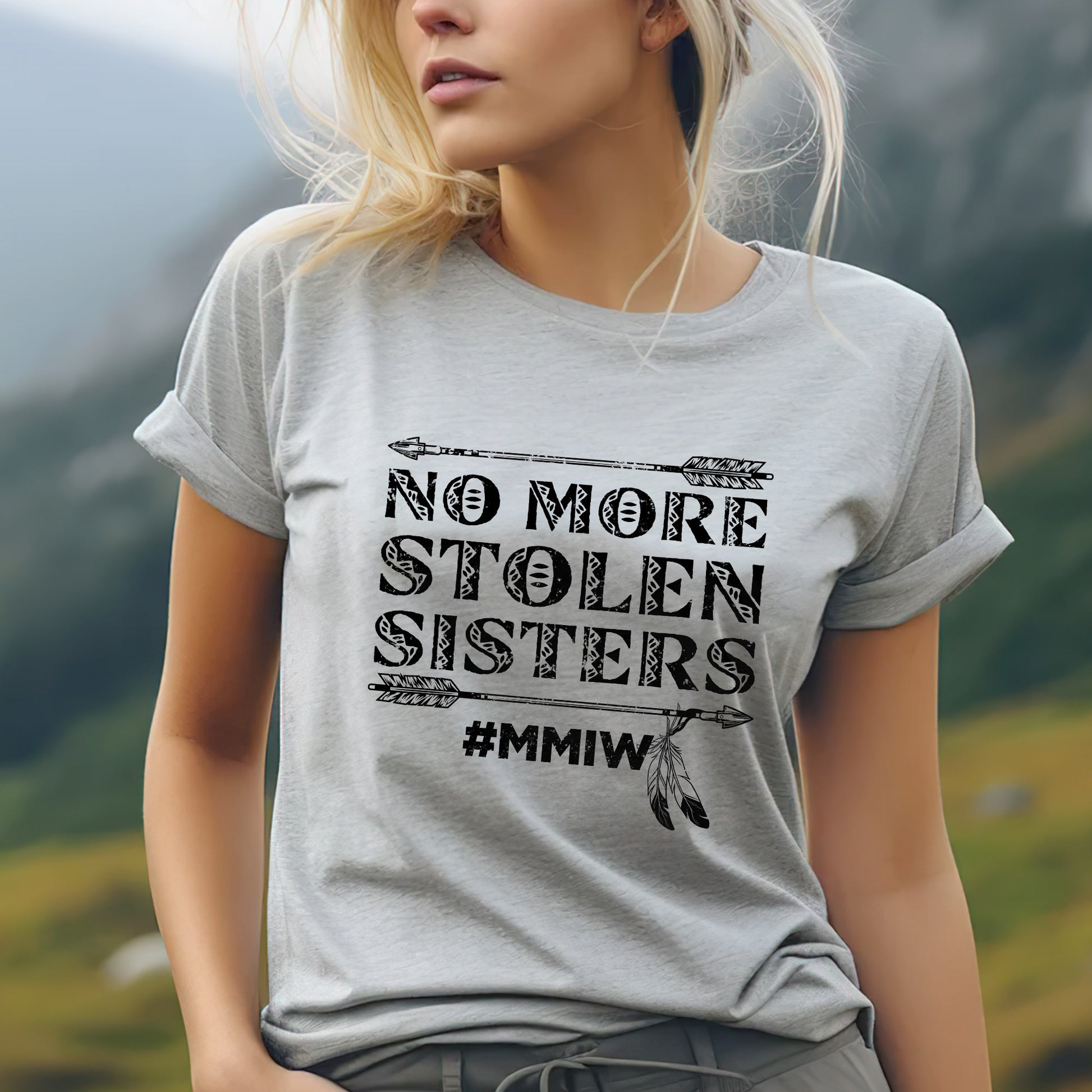 a blonde woman wearing a gray shirt with a slogan on it