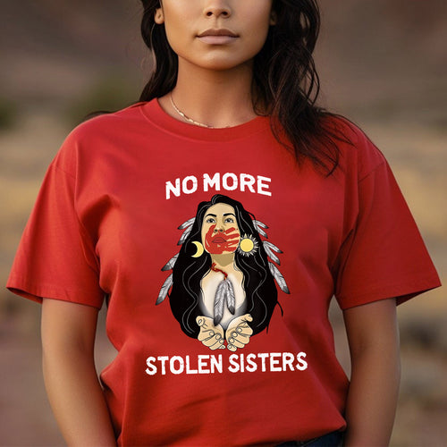 a woman wearing a red shirt that says no more stolen sisters