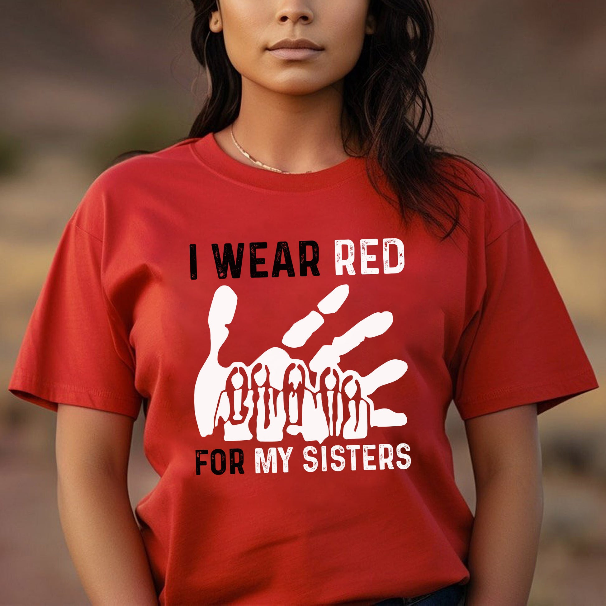 a woman wearing a red shirt that says i wear red for my sisters