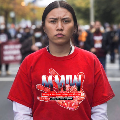 a woman standing in front of a crowd of people