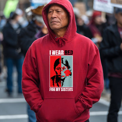 a man wearing a red hoodie with a picture of a man on it