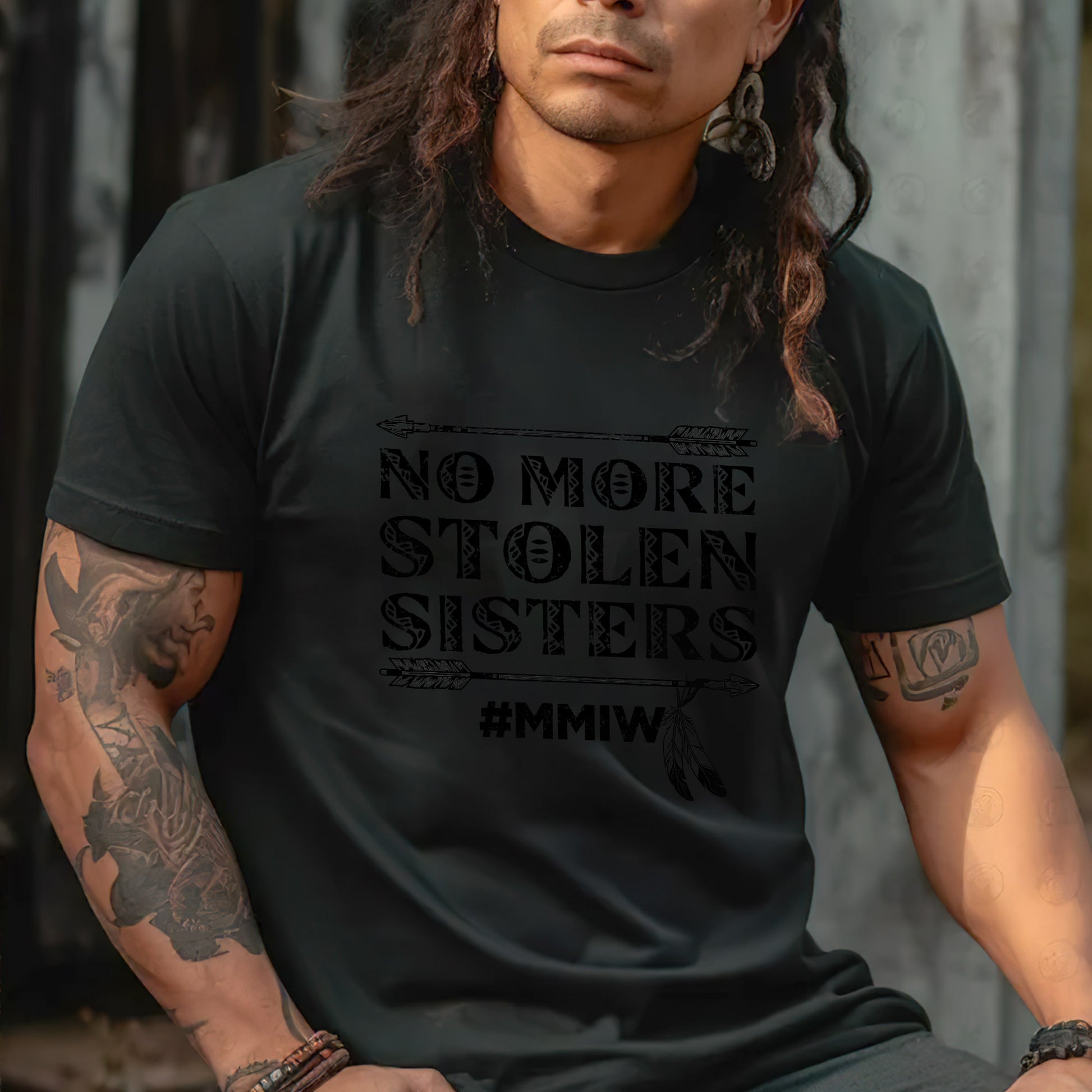 a man with long hair wearing a black shirt