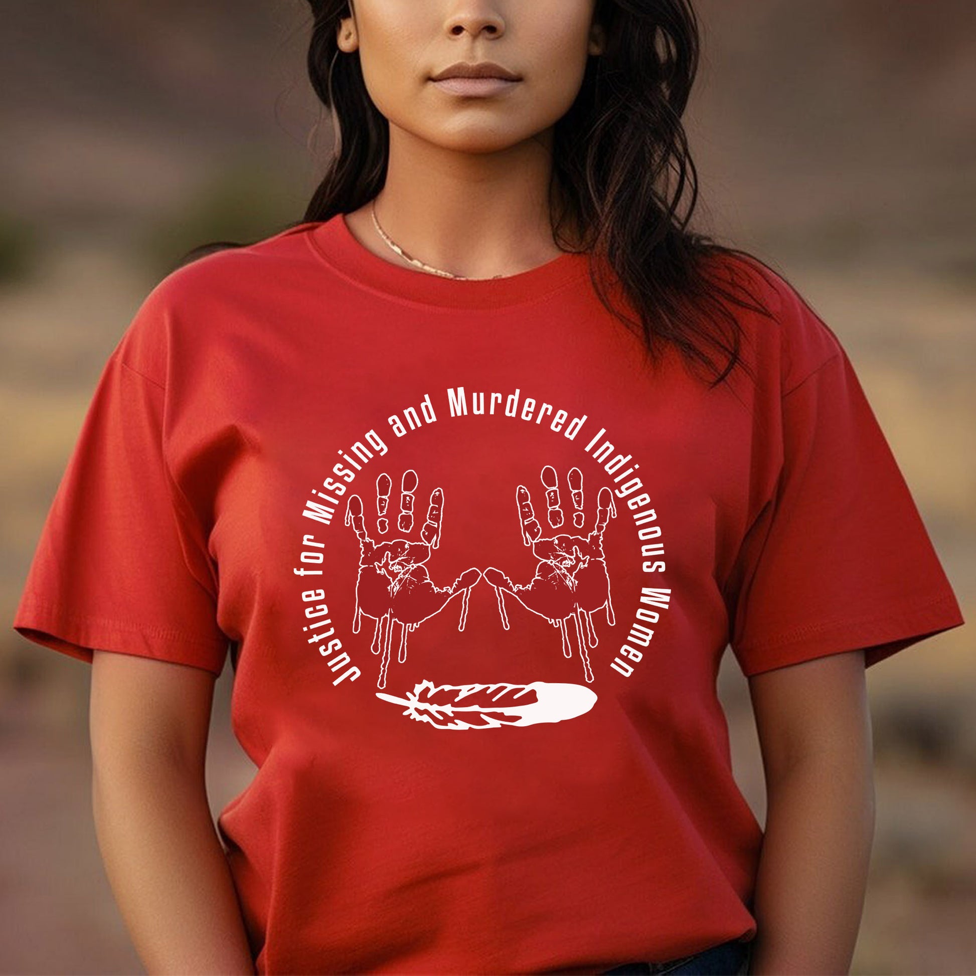 a woman wearing a red t - shirt with two hands on it