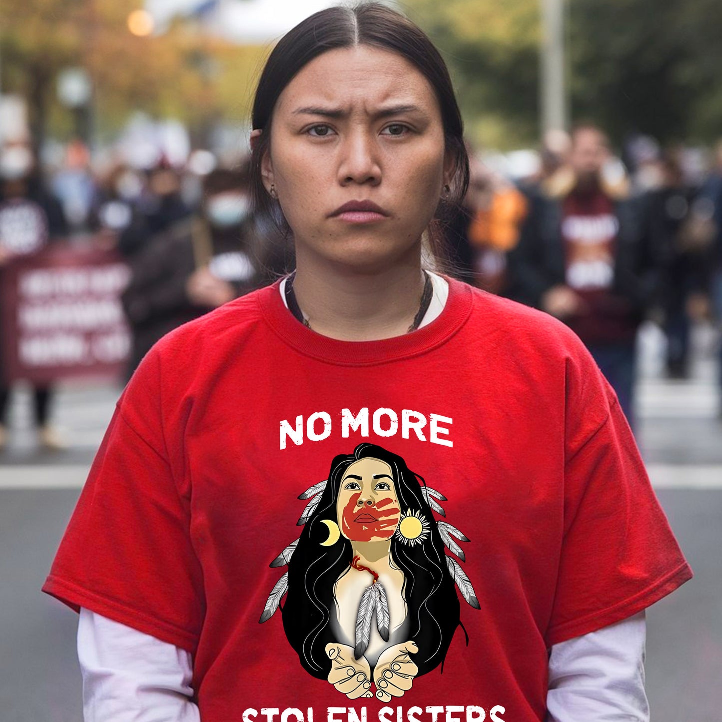 a woman wearing a red shirt with a picture of a woman on it