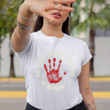 a woman is making a hand gesture with her right hand