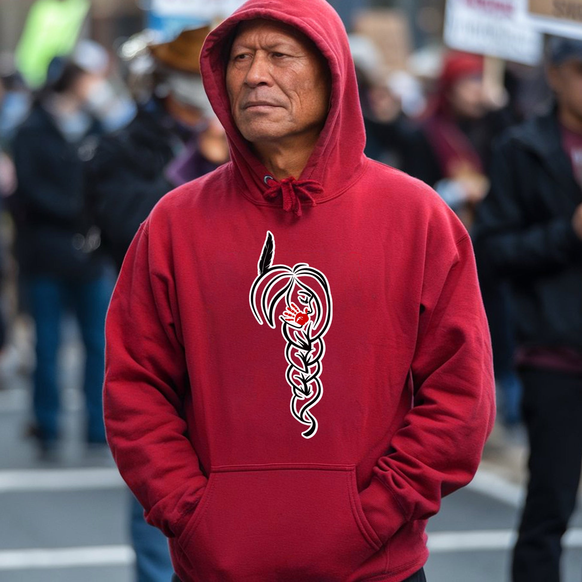 a man wearing a red hoodie with a snake on it