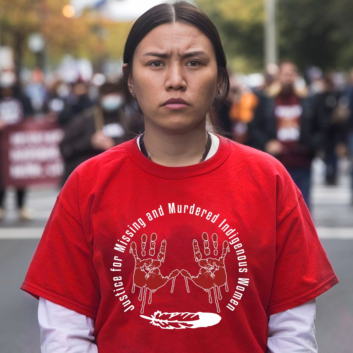 a woman in a red shirt standing in front of a crowd