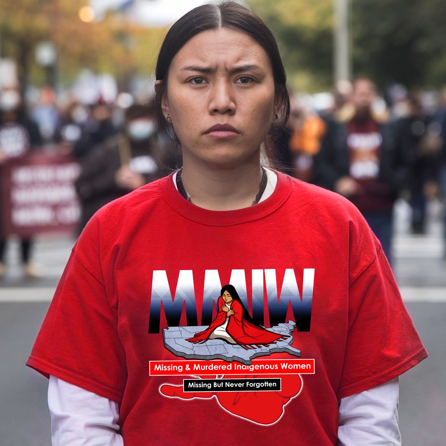 a woman in a red shirt standing in front of a crowd