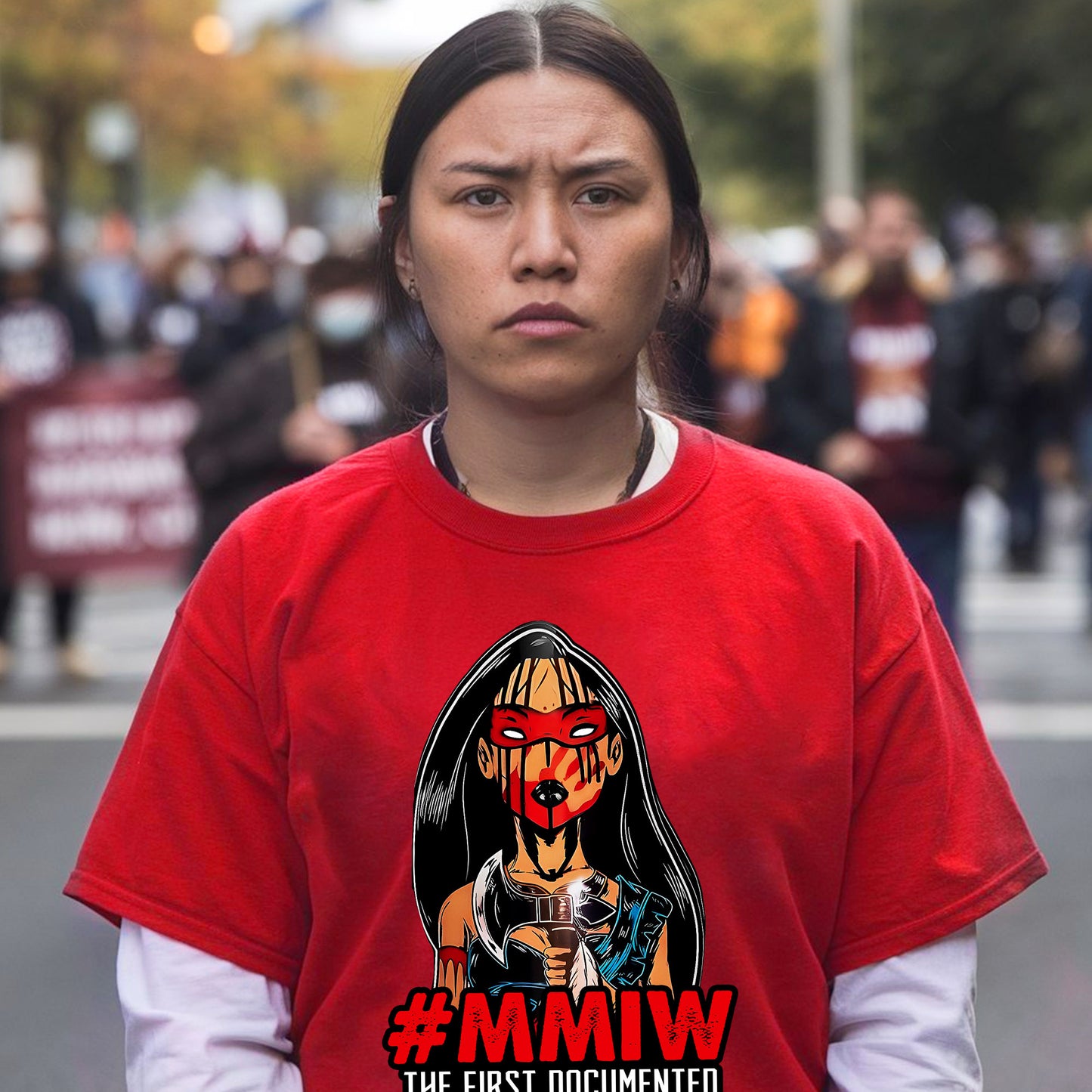 a woman in a red shirt is standing in front of a crowd