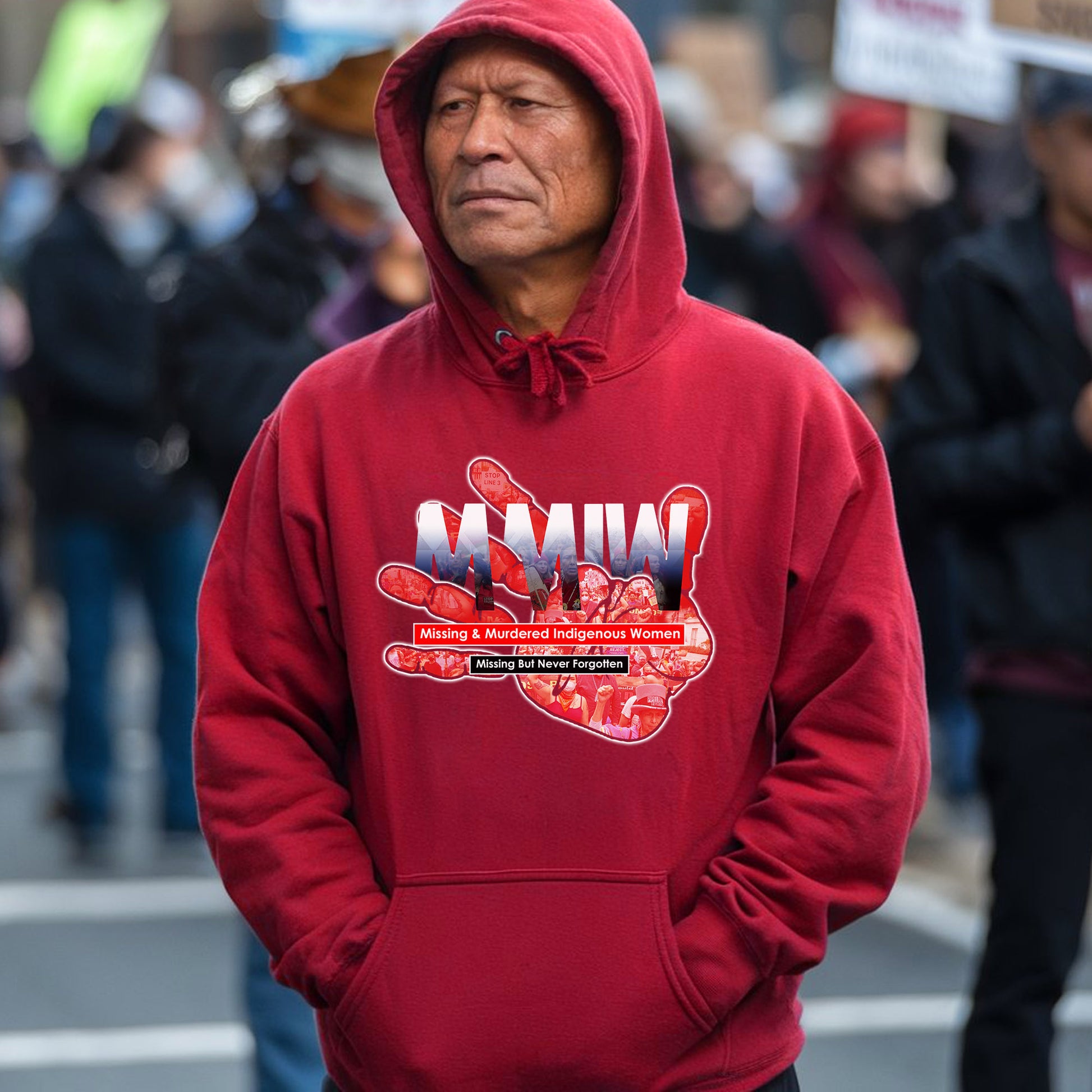 a man in a red hoodie is standing in the street