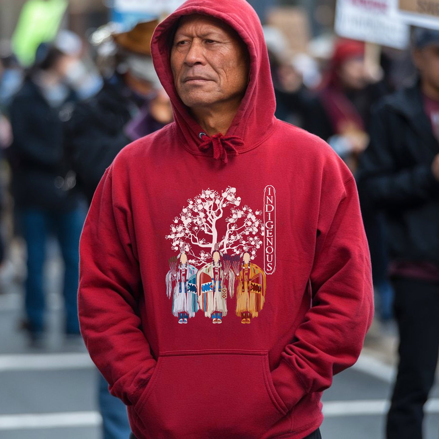 a man in a red hoodie standing in the street