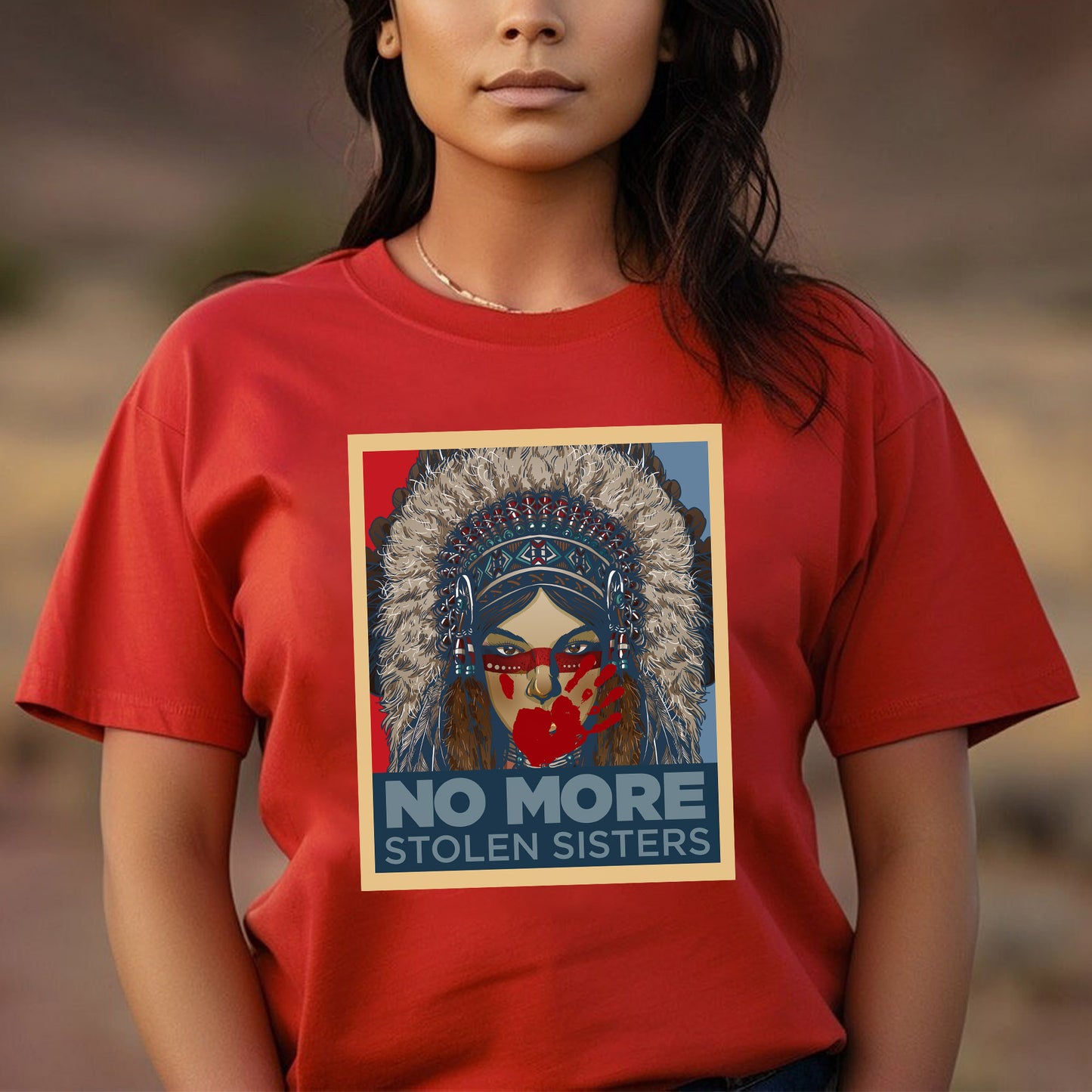 a woman wearing a red t - shirt with a picture of a native american woman