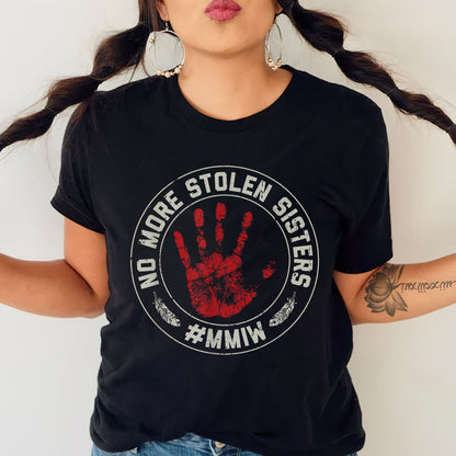 a woman wearing a black shirt with a red hand print