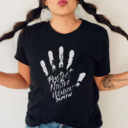 a woman wearing a black shirt with a hand print on it