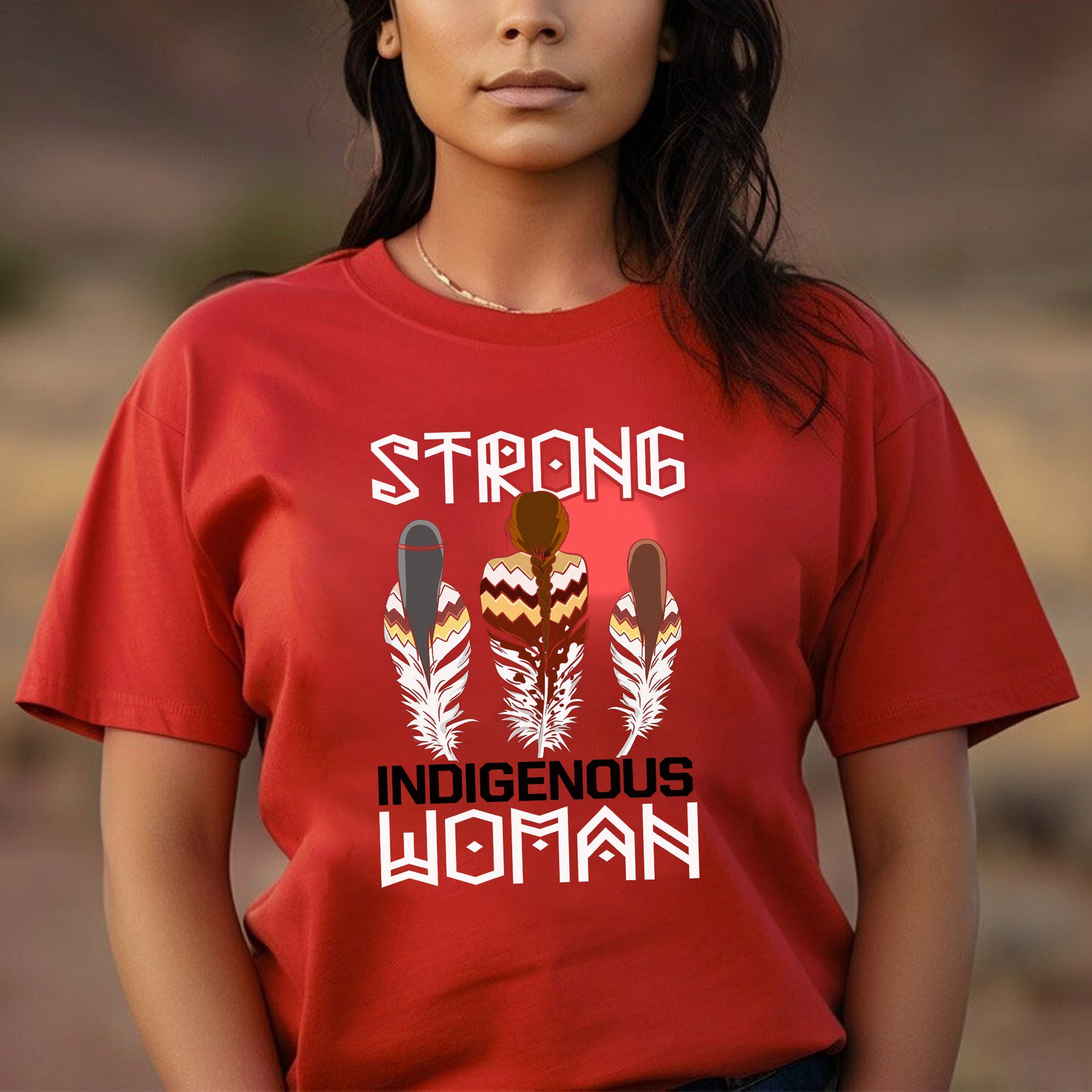 a woman wearing a red shirt that says strong indigenous woman