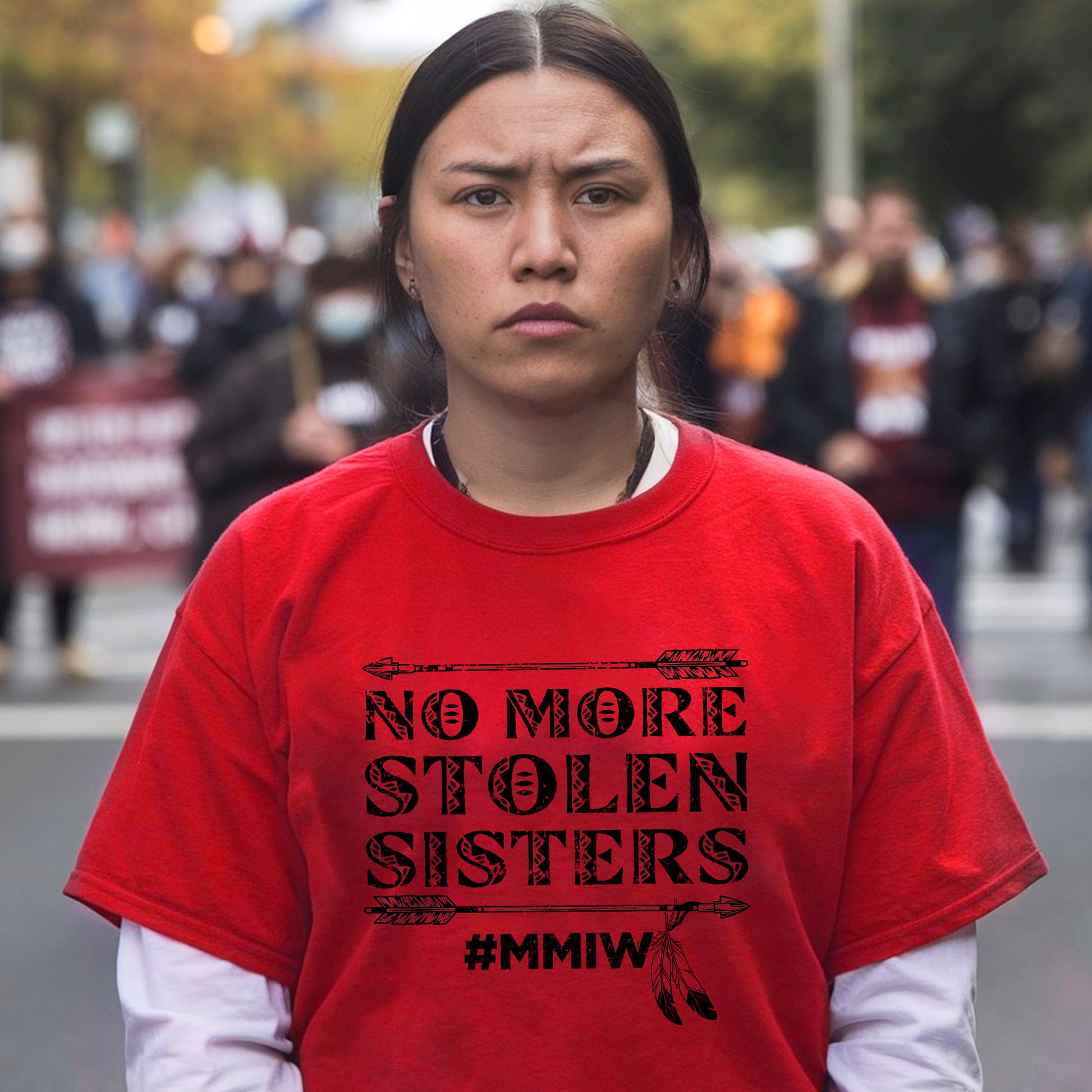 a woman in a red shirt is standing on the street